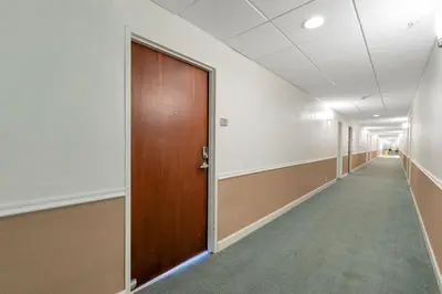 an empty hallway with a wooden door and a corridor at Great apartment in Hollywood with side ocean view! Direct access to the beach! 14th floor in Hollywood