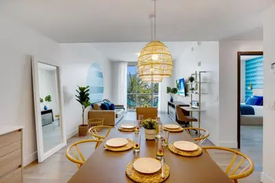 a dining room and living room with a table and chairs at Amazing Pool - Balcony - Up To 6 - Near Beach in Hollywood