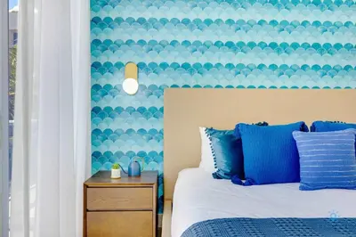 a bedroom with a bed with a blue and white headboard at Amazing Pool - Balcony - Up To 6 - Near Beach in Hollywood