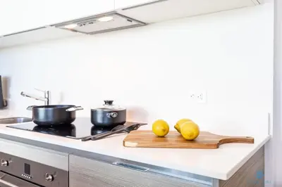 a kitchen counter with two lemons on a cutting board at 5 Tropical Oasis ROOFTOP infinity POOL Hot Tub on Hollywood Boardwalk in Hollywood