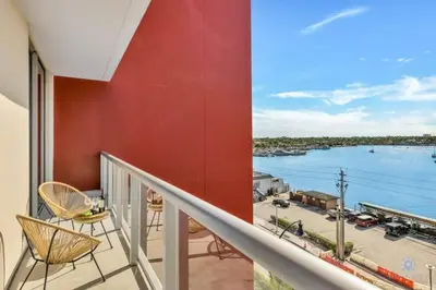 a balcony with a view of the water at Hollywood Beach - Front Bay View - Amazing Pool in Hollywood