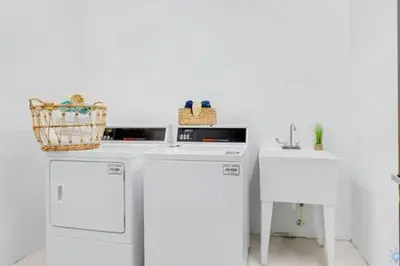 a laundry room with two washes and a sink at Lovely Apartment-Rooftop Oasis - Bay View in Hollywood