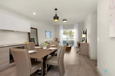 a kitchen and dining room with a table and chairs at Rooftop Pool - Balcony - Hollywood Beach Boardwalk in Hollywood