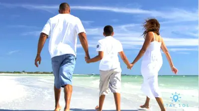 a man and a woman walking on the beach at Rooftop Pool - Balcony - Hollywood Beach Boardwalk in Hollywood