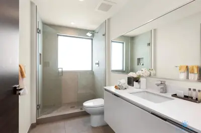 a bathroom with a sink and a toilet and a shower at Balcony - Hollywood Beach Broad-walk - Rooftop Pool in Hollywood