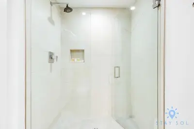 a shower with a glass door in a bathroom at Lovely Apartment - Hollywood Beach - Rooftop Pool in Hollywood