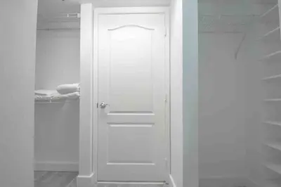 a white door in a room with a closet at Gorgeous 2BR in the Heart of Brickell, Free Parking in Miami