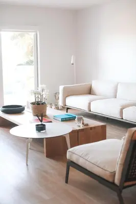 a living room with a couch and a coffee table at Beach Haus Residences in Bal Harbour