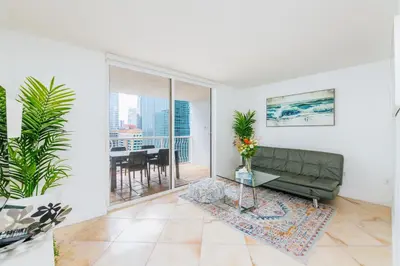 a living room with a couch and a table at Amazing 2 BR APT at Brickell, Free Parking in Miami
