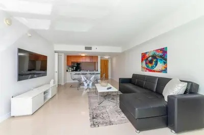 a living room with a couch and a table at Stunning 2BR with Ocean View at Brickell, Free Parking in Miami