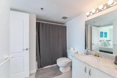 a bathroom with a toilet and a sink and a shower at Stunning 2BR with Ocean View at Brickell, Free Parking in Miami