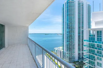 a balcony with a view of the ocean at Bright and Cozy 2BR at Brickell, Free Parking in Miami