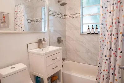 a bathroom with a sink and a toilet and a shower at Casa MIA central location, free parking, fully equipped in Miami