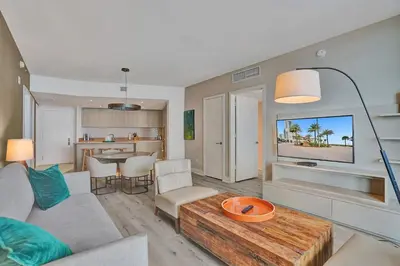 a living room with a couch and a table at Amazing apartments at Lyfe Resort & Residences in Hollywood