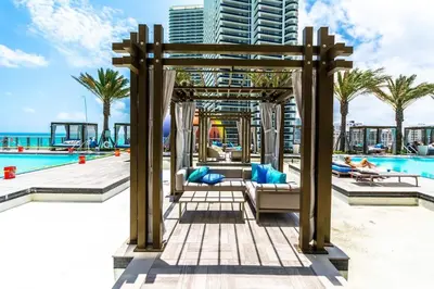 a pergola over a pool at a resort at Amazing apartments at Lyfe Resort & Residences in Hollywood
