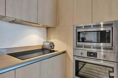 a kitchen with a microwave and a stove at Amazing apartments at Lyfe Resort & Residences in Hollywood