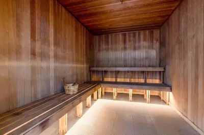 a sauna with a bench and a basket in it at Biscayne Bay View Stay Pool Hot Tub and Amenities in Miami