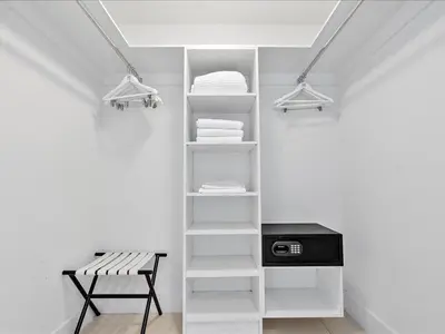 a room with a shelf with towels and a bench at Beachside Contemporary Residence in Lyfe in Hollywood