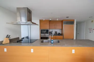 a kitchen with a sink and a counter top at W Hotel Miami Stunning Private Condo With Access to All Hotel Amenities in Miami