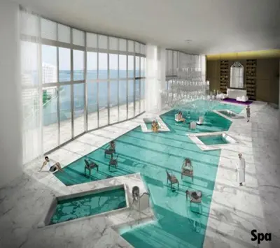 a large swimming pool in a building with people in it at W Hotel Miami Stunning Private Condo With Access to All Hotel Amenities in Miami