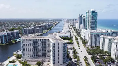 an aerial view of a city with a river and buildings at YP PROPERTY MANAGEMENT in Hollywood