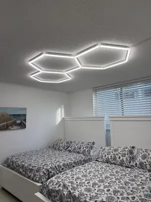 a bedroom with two beds and a ceiling at YP PROPERTY MANAGEMENT in Hollywood