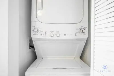a white washer and dryer in a kitchen at Infinite Views, Amazing Pool, Gym, Near Beach in Hallandale Beach