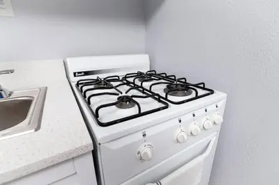 a white stove top oven in a kitchen at Shell on the Beach 106 - RENOVATED in Hollywood