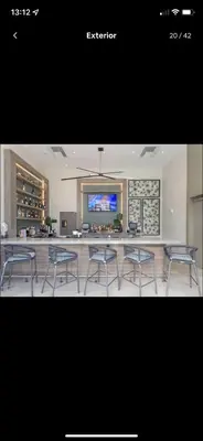 a group of chairs in a room with a bar at Luxury apartment- Hyde House Resort in Hollywood