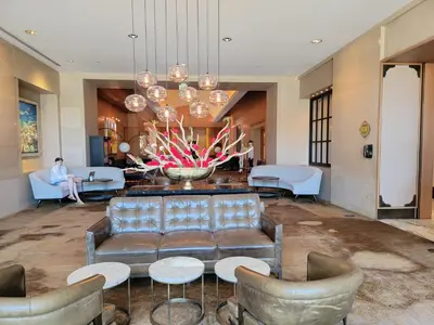 a lobby with a couch and a table and chairs at Four Seasons Studio - Privately Owned Unit in Miami