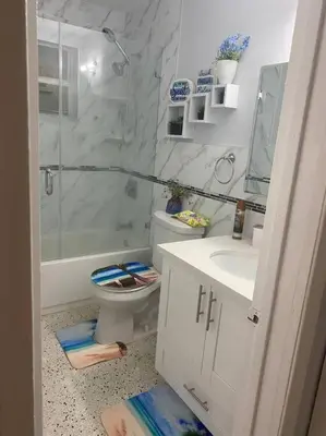 a bathroom with a shower and a toilet and a sink at Relax 523 in Miami