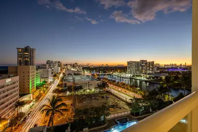 a view of a city at night at Fontainebleau Hotel Ocean View Fits 6! 1 BED/2 BA in Miami Beach