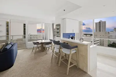 a kitchen and living room with a table and chairs at Fontainebleau Hotel Ocean View Fits 6! 1 BED/2 BA in Miami Beach