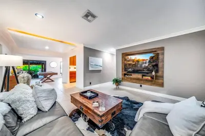 a living room with a couch and a coffee table at Pool and Waterfront Oasis in Fort Lauderdale