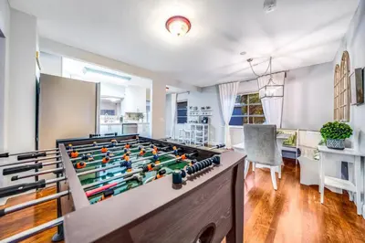 a large game room with a large foos ball at Pool and Beach Relaxing Close to Everything in Dania Beach