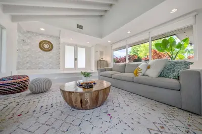 a living room with a couch and a coffee table at Boho House - Stylist Home with Parking and large Yard in Miami
