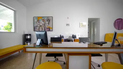 an office with a desk with a computer on it at The Vagabond Hotel Miami in Miami