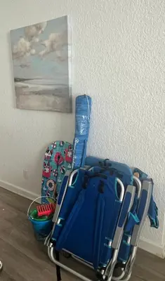 a blue suitcase sitting on the floor next to a wall at The Tides! On the beach, Sea view! in Hollywood
