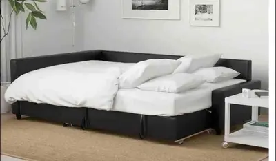 a bed with white sheets and pillows on it at The Tides! On the beach, Sea view! in Hollywood
