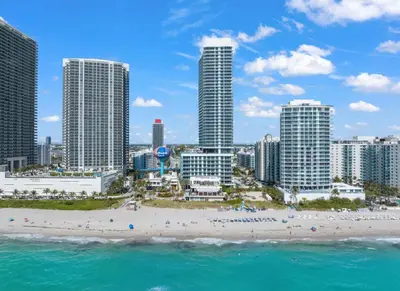 a view of a beach with tall buildings at Lyfe Oceanview Resort Luxury 2 Bedroom Unit in Hollywood