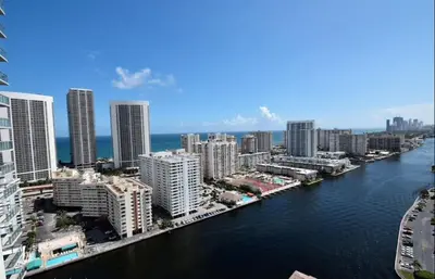 an aerial view of a city with a river and buildings at Chic Beach Studio Walk to Shore Sleeps 4 -14B in Hallandale Beach