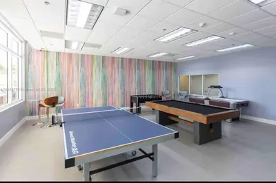 a large room with a ping pong table in it at High Floor Unit Located in Brickell - Free Parking in Miami
