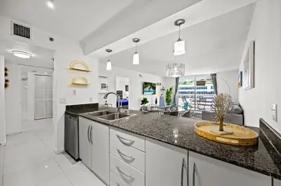 a kitchen with a sink and a counter top at Amazing location W Parking in Miami in Miami