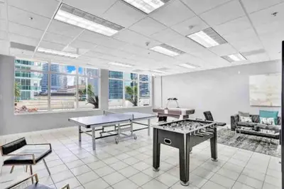 a large room with tables and chairs in a building at Amazing location W Parking in Miami in Miami