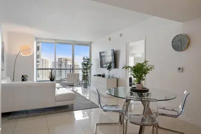 a living room with a white couch and a table at Iconic Icon W Unit - Pool & Ocean Views in Miami