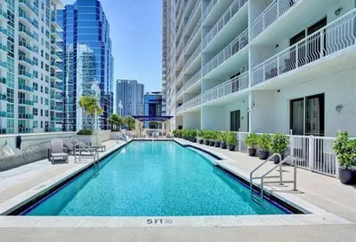 a swimming pool in the middle of a building at INCREDIBLE OCEAN VIEW 3 BEDROOMS UNIT in Miami