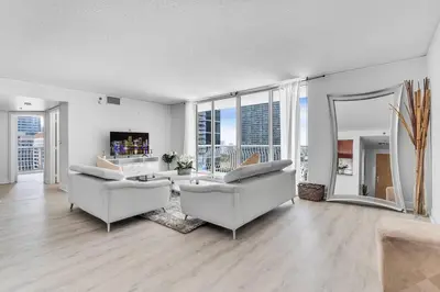 a living room with two couches and a large window at Modern 2/2 with Beautiful Ocean and Brickell Views in Miami