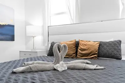 a towel animal is laying on a bed at Modern 2/2 with Beautiful Ocean and Brickell Views in Miami