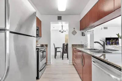 a kitchen with a stainless steel refrigerator at Modern 2/2 with Beautiful Ocean and Brickell Views in Miami