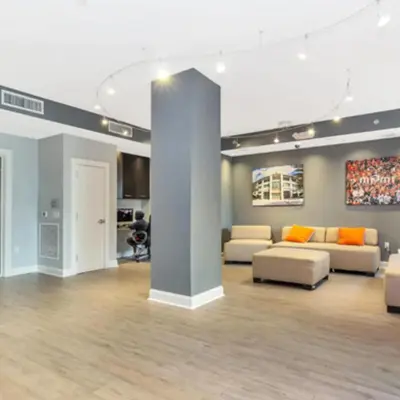 a large living room with couches and a column at Beautiful Apartment with Pool in Miami in Miami